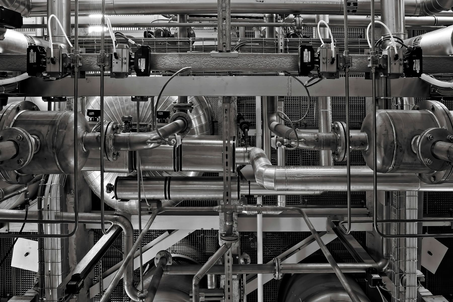 Stainless process piping and valve actuators in an industrial facility